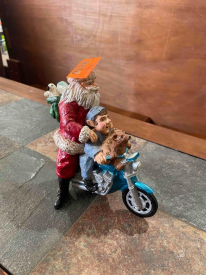 Santa and elf on motorcycle