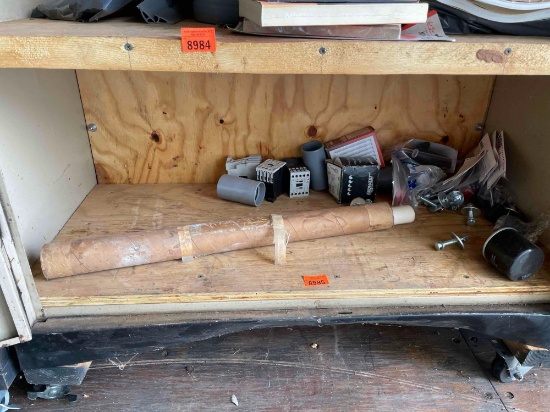 Items on shelf, poster, bolts, filter and more