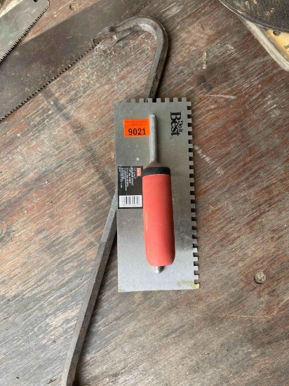 Notched trowel and crow bar