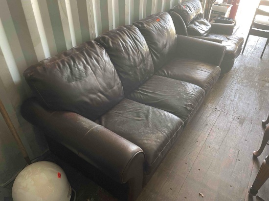 Leather sofa damage noted in photo *BUYER IS RESPONSIBLE FOR LOADING*