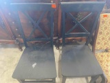 2 black wooden chairs