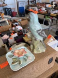 Parrot figurine and flowered plate