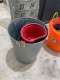 Rope, metal trash can, red bucket