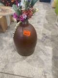 Brown vase with artificial flowers