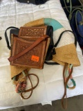 2 leather purses and one woven bag