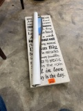 Wall art with saying and a Mater poster
