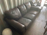 Leather sofa damage noted in photo *BUYER IS RESPONSIBLE FOR LOADING*