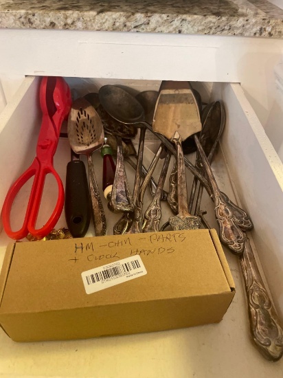 various silver serving utensils; clock hands; misc