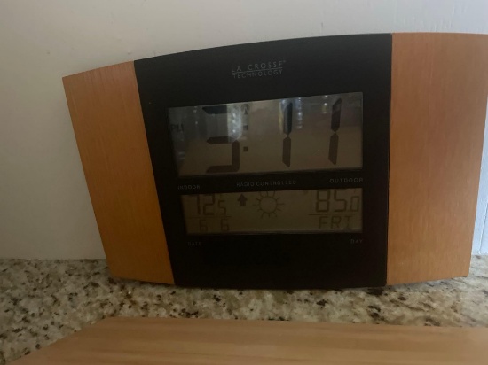 wooden cutting board; weather/calendar clock
