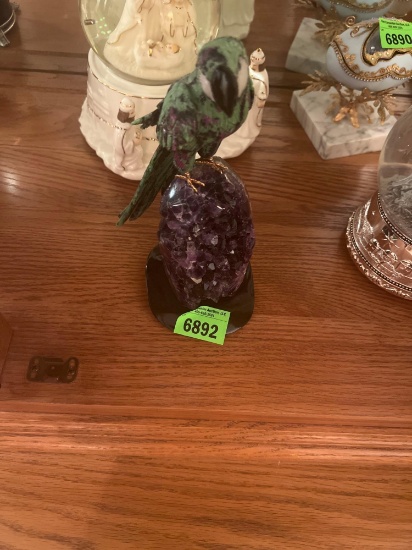 carved bird on gemstones