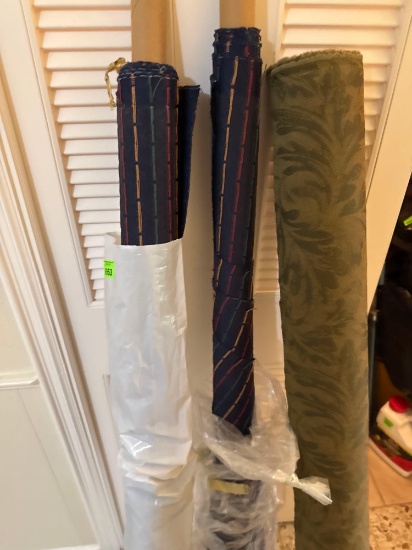 Three rolls of fabric