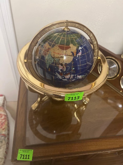 globe with rotating rings