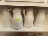 7 vintage white insulated pitchers