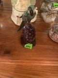 carved bird on gemstones