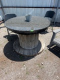 wood spool table with granite top