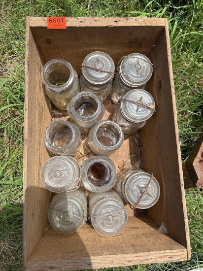 Wood crate with Ball Kerr and Atlas mason jars and lids
