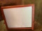 Small standing sign with chalkboard on one side and white board on the other