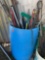 Blue barrel with misc poles, mops, and more *BUYER IS RESPONSIBLE FOR LOADING*