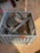 Milk crate with broom head, rope, metal container, and other miscellaneous items