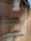 Wire wall hanging with items springs,clamping light, other misc items