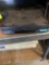 VHS player and weight and wall decor