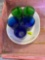 2 green and 2 blue glasses and a plate