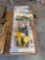 Silverware, measuring cups, mini tool bag and a paint stick