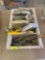 Gray plastic caddy with knife, wrench, castor, spoon and more