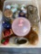 Several glass containers with corks, plastic pink bowl with lid, ceramic baby shoe, ceramic egg,