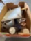Plastic white tree, metal TV trays, large measuring cups Tupperware, Cheese slicer, utensils, and