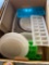 Plastic ice trays, dish strainer, microwave, bacon cooker, miscellaneous lids, and more
