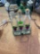 set of 3 glass bottles with grape pattern in metal carry caddy