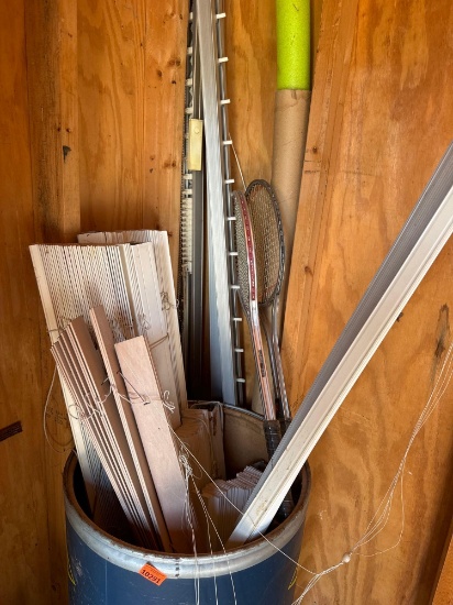 Barrel with window blinds, tennis rackets and other misc items
