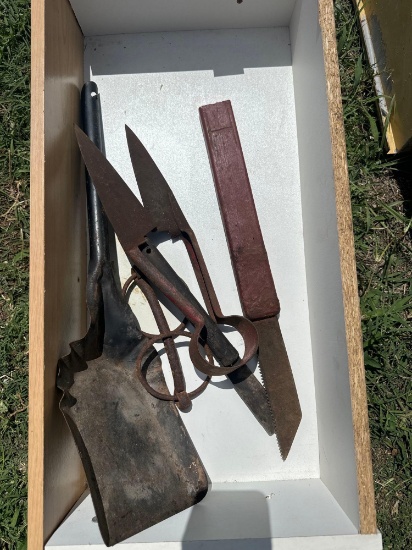 Drawer with small shovel, large cutting shears, vintage hand saw