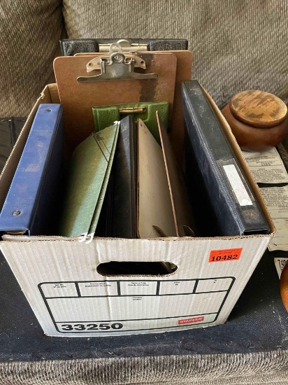 Box of binders and clip boards