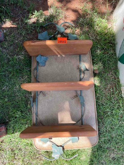 Wooden wall shelves with metal ivy