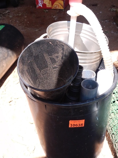 Small black trashcan with funnel and metal canister and other miscellaneous items