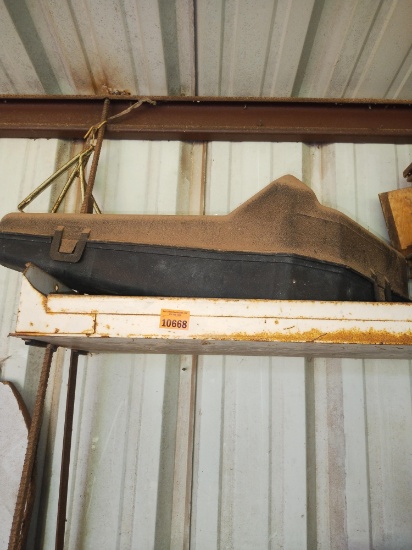 Pieces of wood and an empty chainsaw case