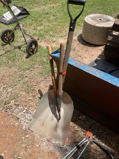 Snow shovel and tree loppers