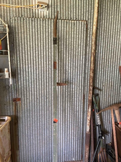 Pole saw blade attached to wood pole