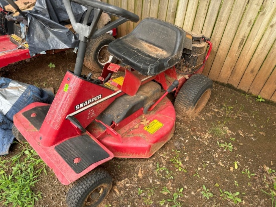 Briggs and StratonSnapper riding lawn mower Noted flat tires Condition is unknown *BUYER IS