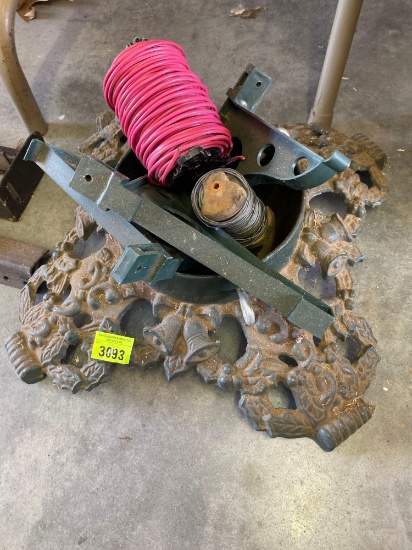 Cast iron Christmas tree base and small spool of wire