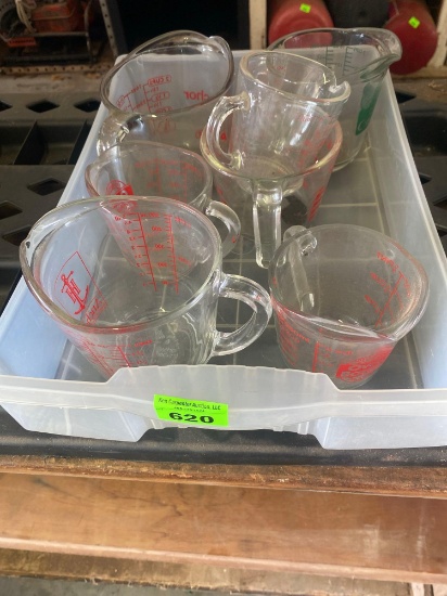Several pyrex measuring cups