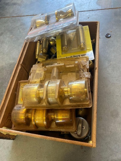 Box of used door handles, dead bolts and spring hinges