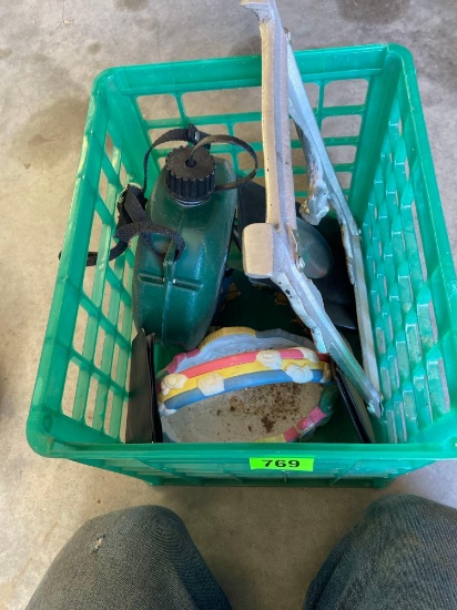 Small green milk crate with a metal flower serving tray, green canteen, a wallet, possibly metal
