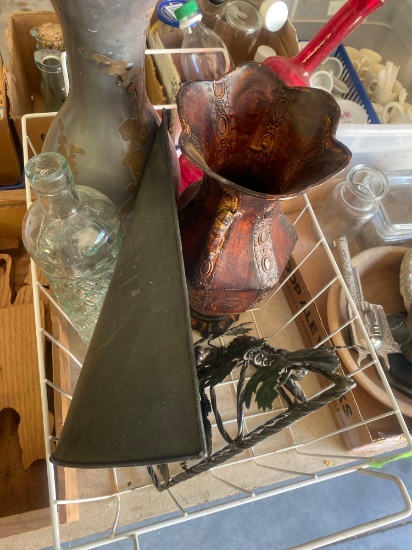 Two glass vases, two metal vases, and two decorative wall hangings for artificial flowers