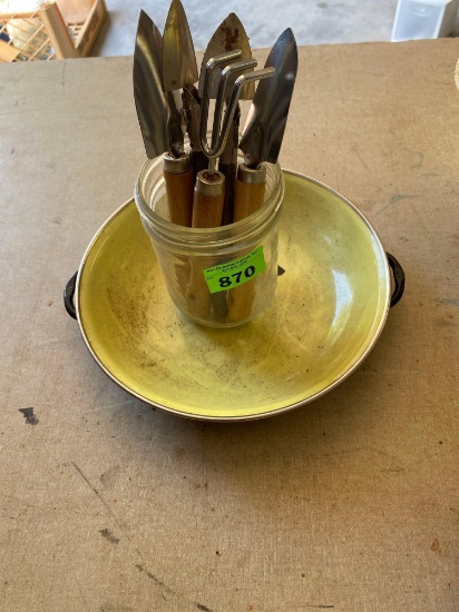 Ceramic coated lid and a cup with small garden utensils