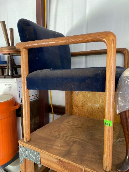 Wood frame chair with blue seat cushions