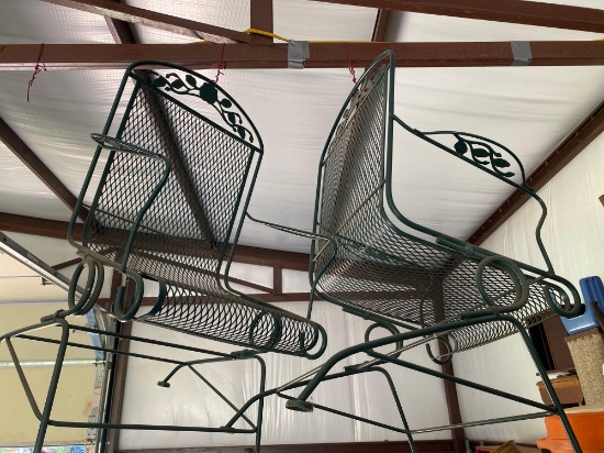 Two green metal outside chairs