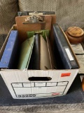 Box of binders and clip boards